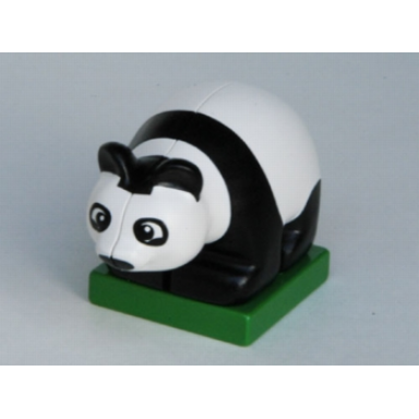 white duplo panda baby cub on green base eyes looking forward