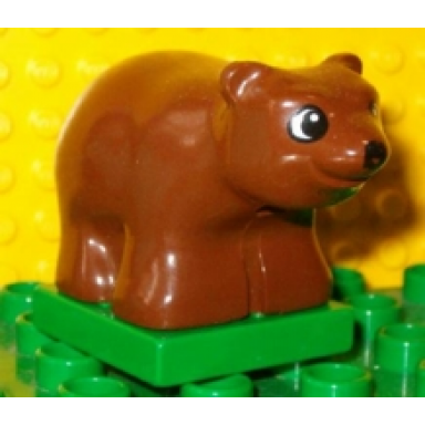 brown duplo bear baby cub on green base with black and white eyes round black round nose pattern