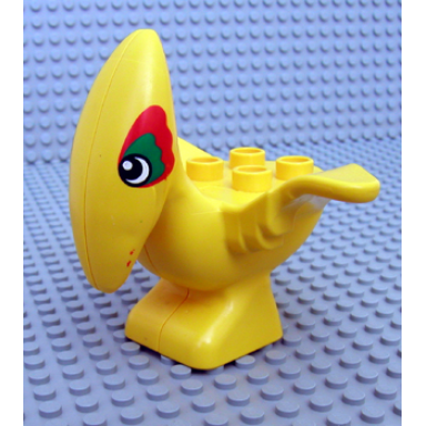 yellow duplo dinosaur pteranodon adult with green and red around eyes pattern