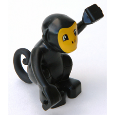 black duplo monkey curled tail with bright light orange face pattern