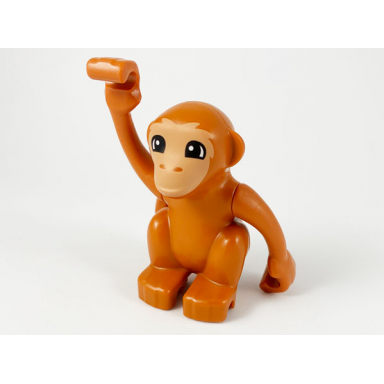 dark orange duplo monkey curled tail turned to side with nougat face pattern