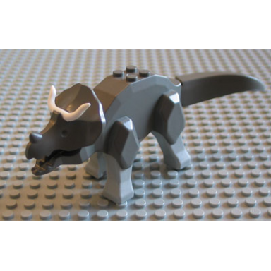 dark gray dinosaur triceratops with light gray legs and white horns