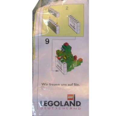 dragon sculpture olli the dragon holding sign legoland deutschland