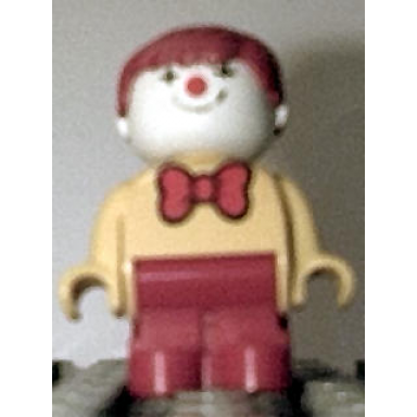 duplo figure child type 1 boy red legs yellow top with red bow tie red hair clown