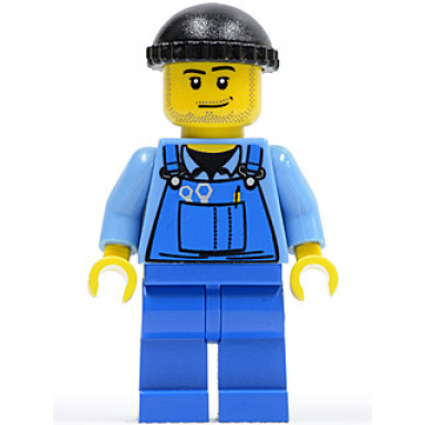 overalls with tools in pocket blue black knit cap smirk and stubble beard