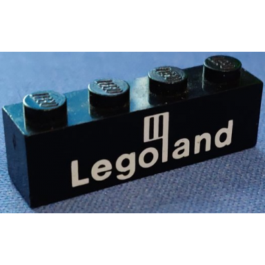 black brick 1 x 4 with white legoland logo pattern