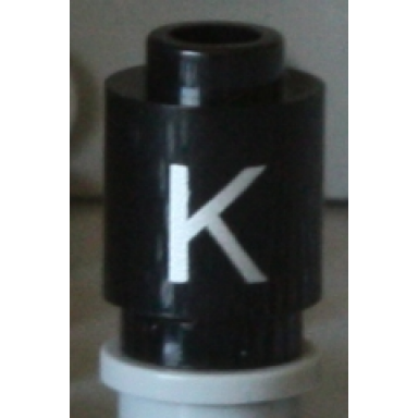 black brick round 1 x 1 with silver capital letter k pattern