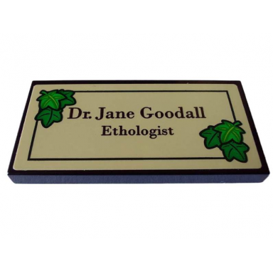 black tile 2 x 4 with dr jane goodall ethologist in black frame with green leaves on tan background pattern sticker - set 40530