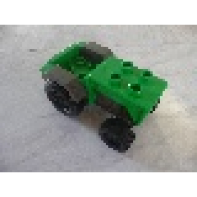 bright green duplo farm tractor with black wheels dark gray engine and fenders and dark gray hitch