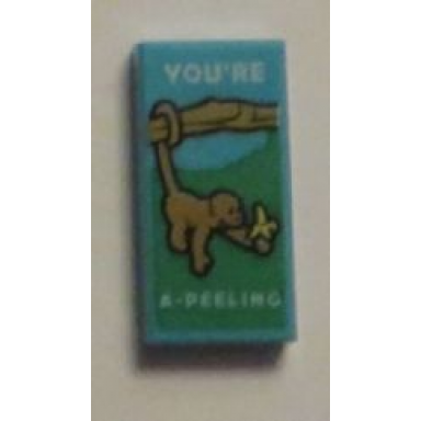 medium azure tile 1 x 2 with monkey with banana and youre a-peeling pattern