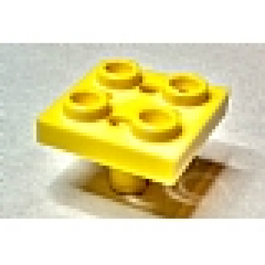yellow plate modified 2 x 2 with pin on bottom small holes in plate and locking fingers on underside