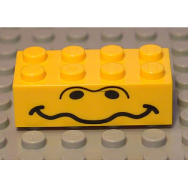yellow brick 2 x 4 with black nostrils and wavy mouth pattern