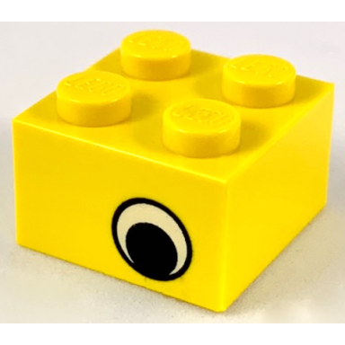 yellow brick 2 x 2 with black eye offset with white pattern on opposite sides