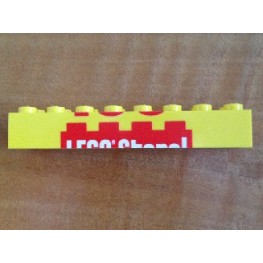 yellow brick 2 x 8 with top half of lego store! pattern