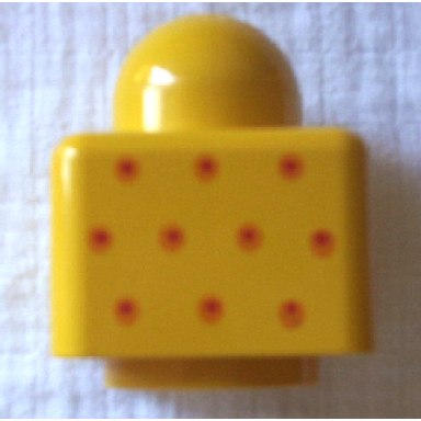 yellow primo brick 1 x 1 with small red and orange dots pattern on opposite sides