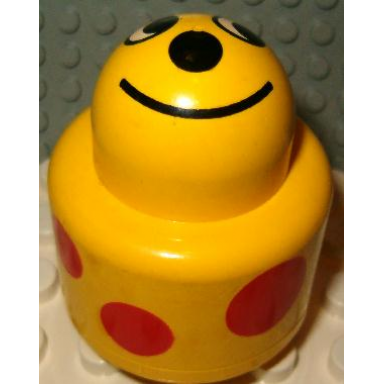 yellow primo brick round rattle 1 x 1 with face and red spots pattern