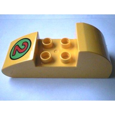 yellow duplo brick 2 x 6 x 2 rounded ends with red number 2 on green circle pattern