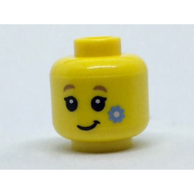yellow minifigure head child with dark tan eyebrows black eyes and eyelashes lopsided grin bright light blue flower on cheek pattern
