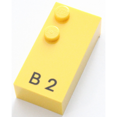 yellow brick braille 2 x 4 with 2 studs with black capital letter b number 2 pattern dots-12 â 