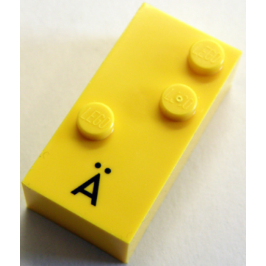 yellow brick braille 2 x 4 with 3 studs with black capital letter a with diaeresis ã pattern dots-345 â  german