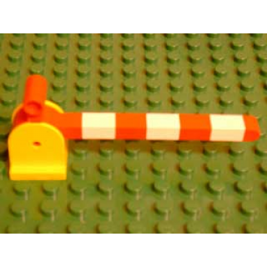 yellow duplo train crossing gate base with red duplo train crossing gate crossbar with large handle with white stripes pattern