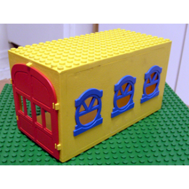 yellow fabuland garage block with blue windows and red doors