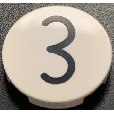 white tile round 2 x 2 with bottom stud holder with black kissy mouth number 3 pattern