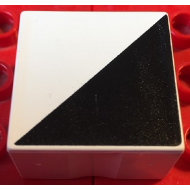 white duplo tile 2 x 2 x 1 with shape black right triangle pattern