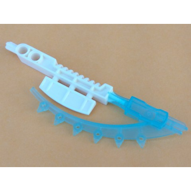 white bionicle weapon hordika teeth tool with molded trans-light blue flexible end pattern
