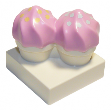 duplo cupcakes with molded bright pink swirl icing and printed bright light yellow and light aqua dots pattern