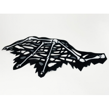 white cloth wing dragon left tattered with bones black skin and dark bluish gray spots pattern