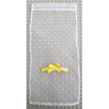white scala cloth curtain with yellow bow and dots pattern
