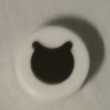 white tile round 1 x 1 with black circle eye with partially closed curved eyelid pattern
