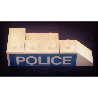 white stickered assembly 5 x 2 x 1 with police pattern model left side sticker - set 394 - 1 brick 1 x 2 2 plate 2 x 2 1 plate 1 x 2 1 slope 2 x 1