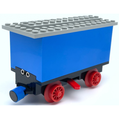 blue train battery box car with three contact holes red switch lever blue and red magnets red wheels and light gray roof