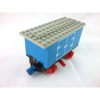 blue train battery box car with two contact holes red switch lever blue and red magnets red wheels and light gray roof with hinged doors pattern on both sides stickers - set 7720