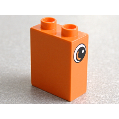 orange duplo brick 1 x 2 x 2 with eye with white spot and curve pattern on both sides