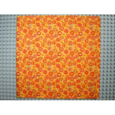 orange scala cloth bedspread with red aqua pink and yellow circles pattern