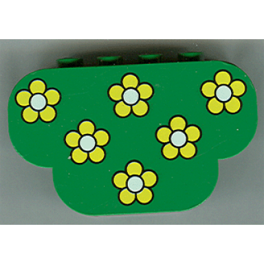 green slope curved 6 x 2 x 3 triple with 8 studs with yellow flowers pattern