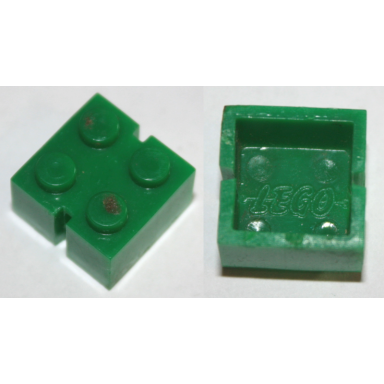 green brick 2 x 2 without bottom tubes slotted with 2 slots opposite