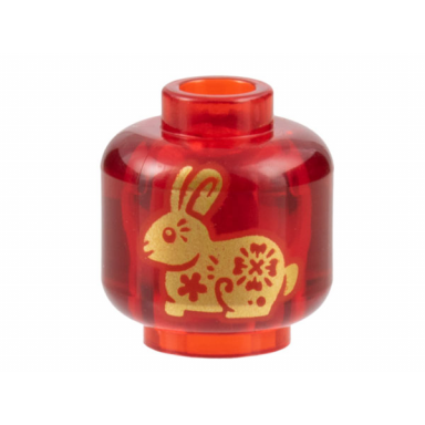 trans-red minifigure head without face with gold rabbit pattern on both sides