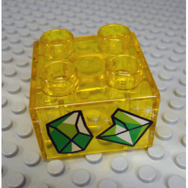 trans-yellow duplo brick 2 x 2 with 2 sparkling green gems pattern