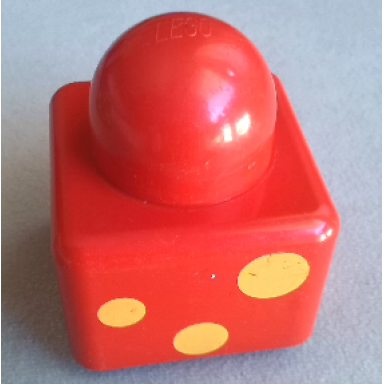 red primo brick 1 x 1 with 3 yellow spots pattern