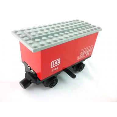 red train battery box car with three contact holes black switch lever black magnets black wheels and light gray roof with db 7722 pattern on both sides stickers - set 7722