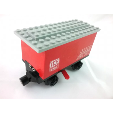 red train battery box car with three contact holes red switch lever black magnets black wheels and light gray roof with db 7722 pattern on both sides stickers - set 7722