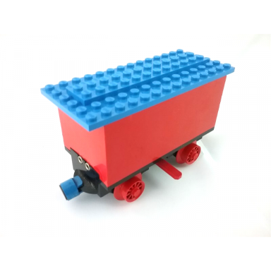 red train battery box car with two contact holes red switch lever blue and red magnets red wheels and blue roof