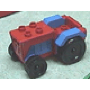 red duplo farm tractor with black wheels blue engine and fenders and red hitch