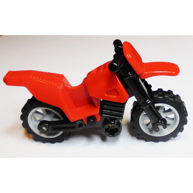red motorcycle dirt bike with black chassis long fairing mounts and light bluish gray wheels