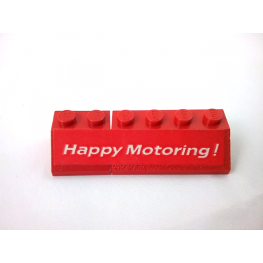 red stickered assembly 6 x 2 x 1 with happy motoring ! pattern model right side sticker - set 554 - 1 slope 45 2 x 2 1 slope 45 2 x 4