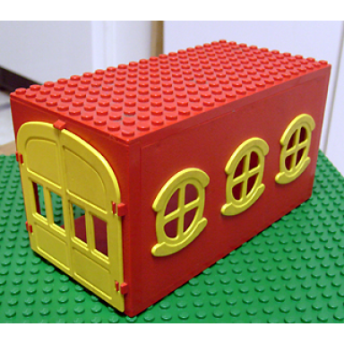 red fabuland garage block with yellow round symmetric windows and yellow doors